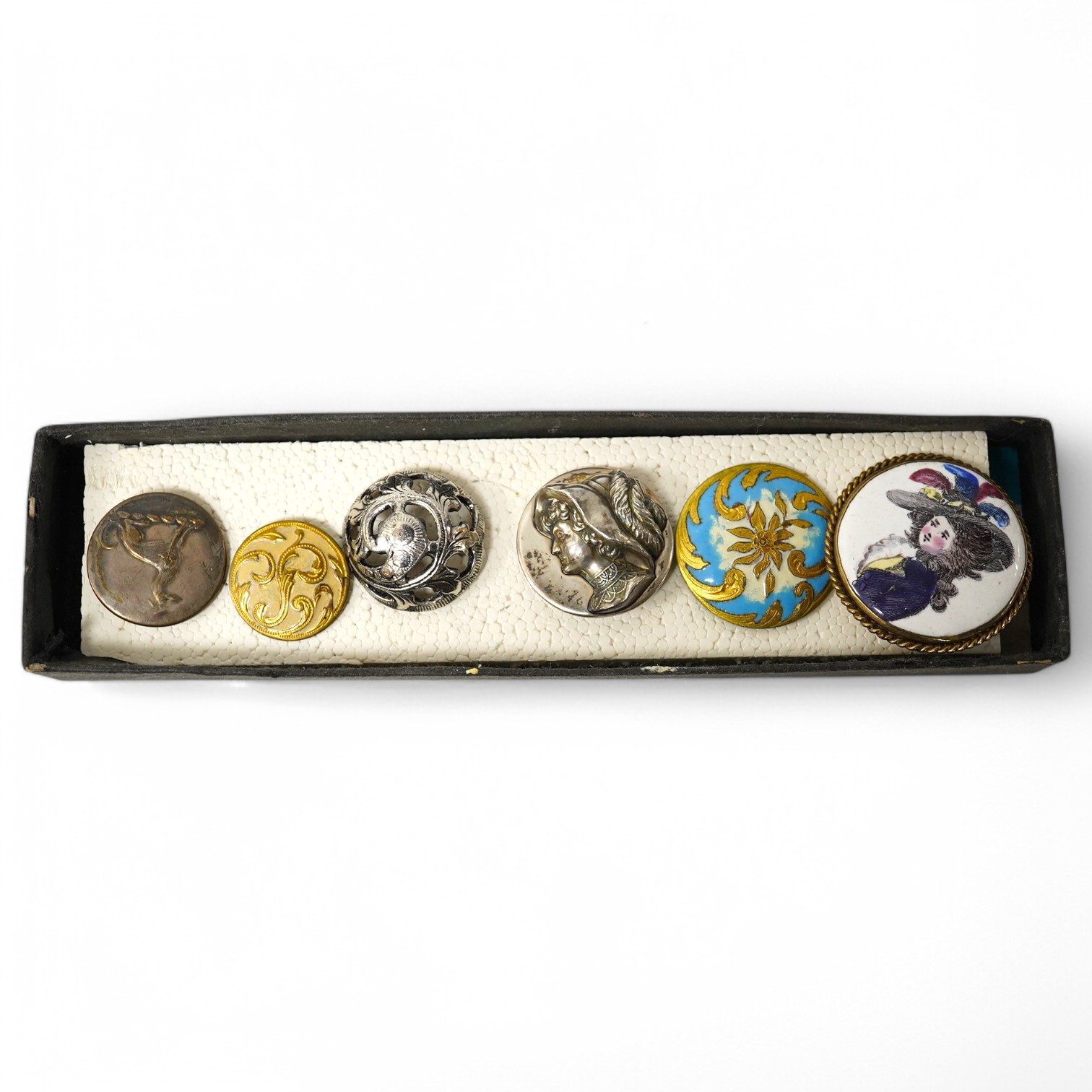 Six assorted late 19th/early 20th century buttons;, Condition - good